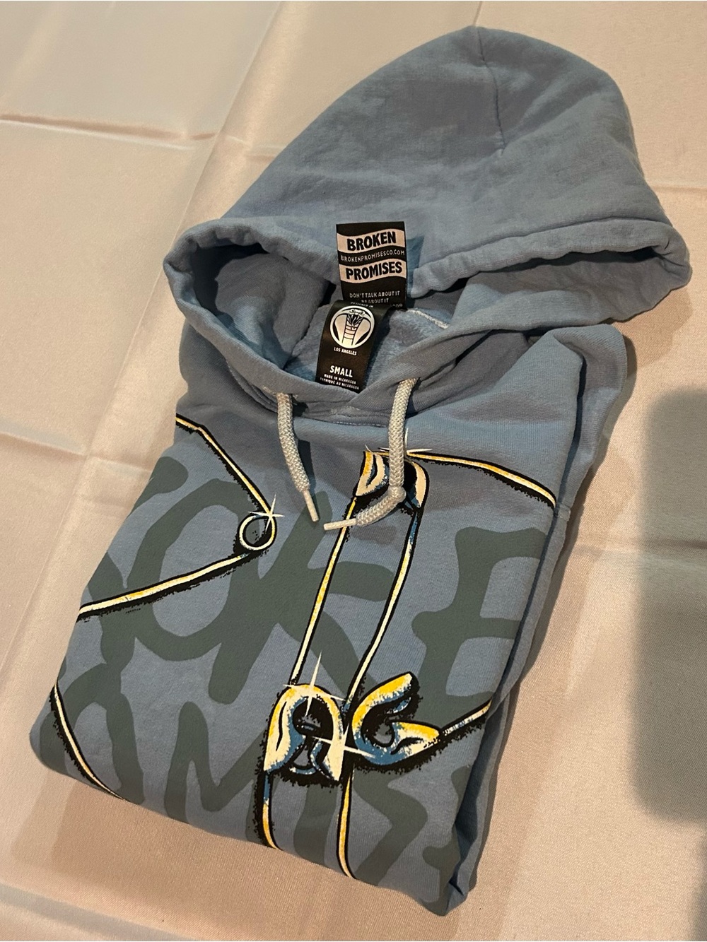 NWOT Broken Promises Piercer Blue Hoodie